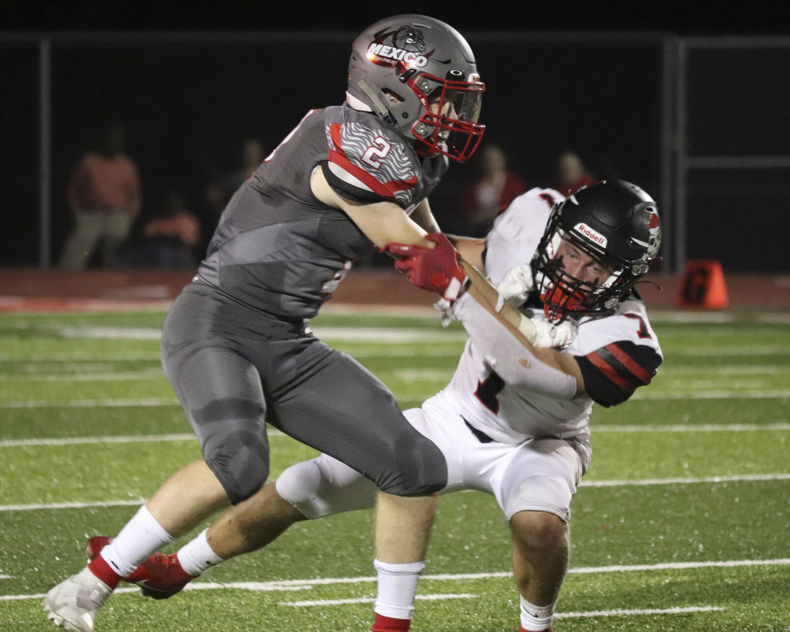 Senior Conor Johnson stifles an opponent from Hannibal High School